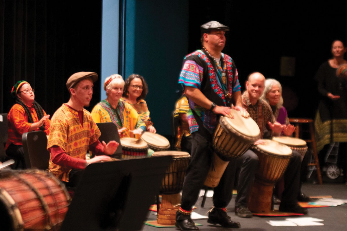 African Drumming Ensemble playing on a stage.