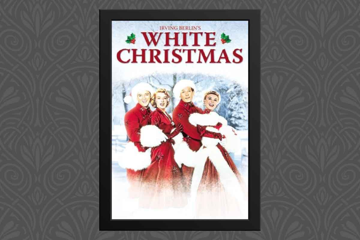 White Christmas movie poster with snow and carolers