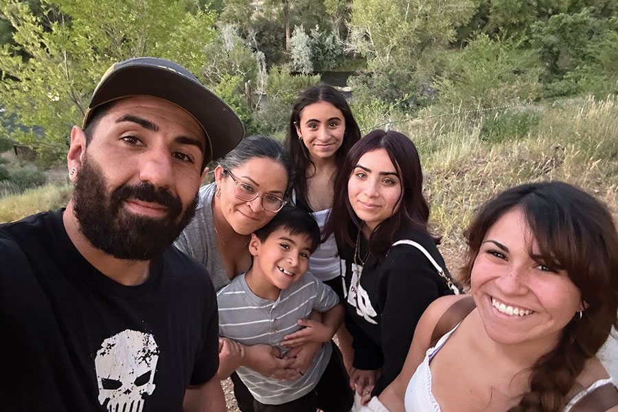 The Henderson Family taking a selfie on a trail