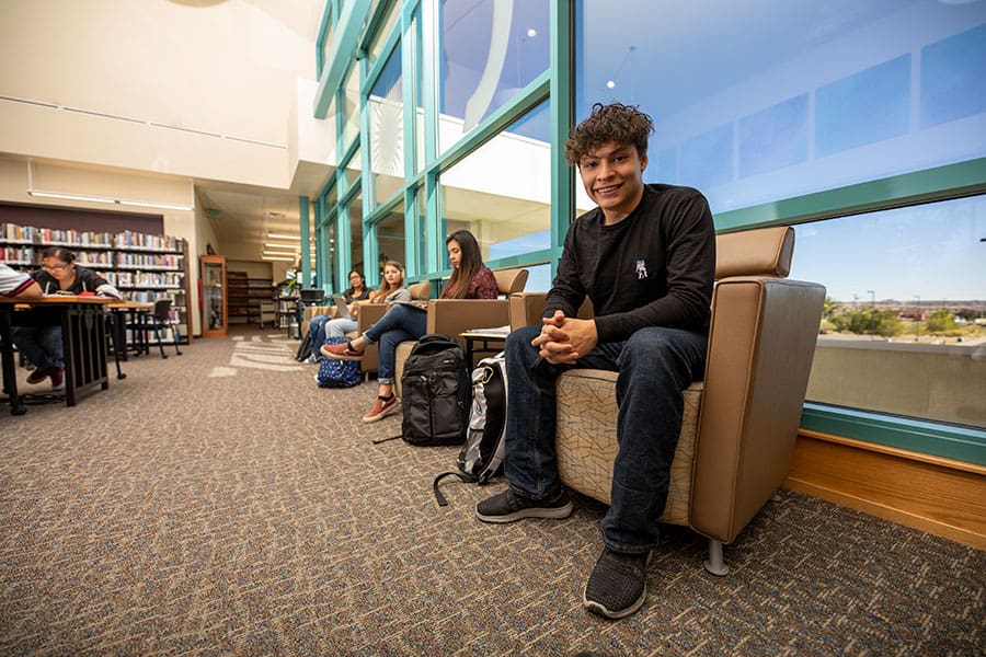 A student sitting down in the library