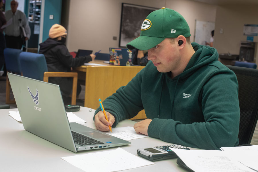 San Juan College Student working on laptop