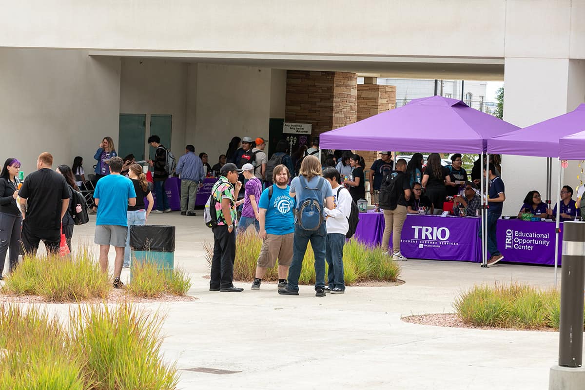 groups of students enjoying fall rush at Learning Commons Plaza