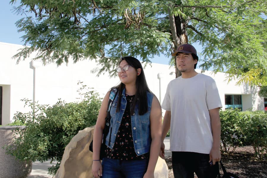 Two students standing outside on SJC Campus