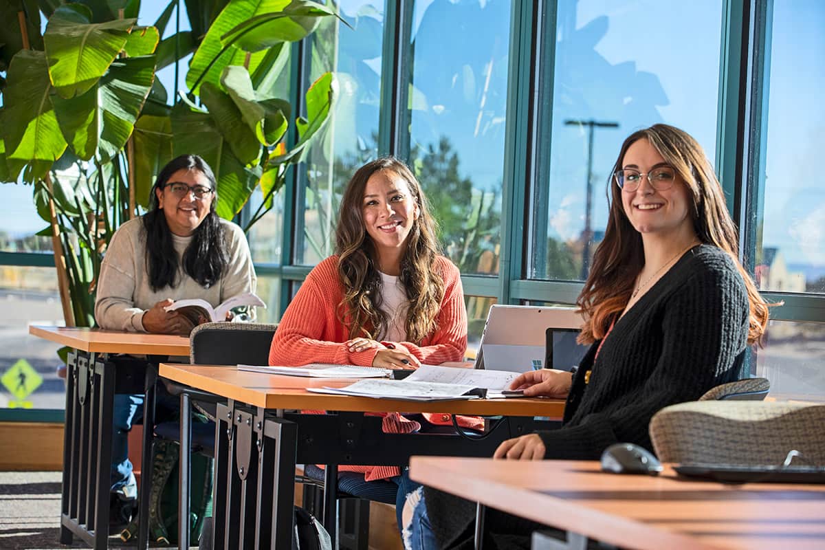 smiling students in the main library