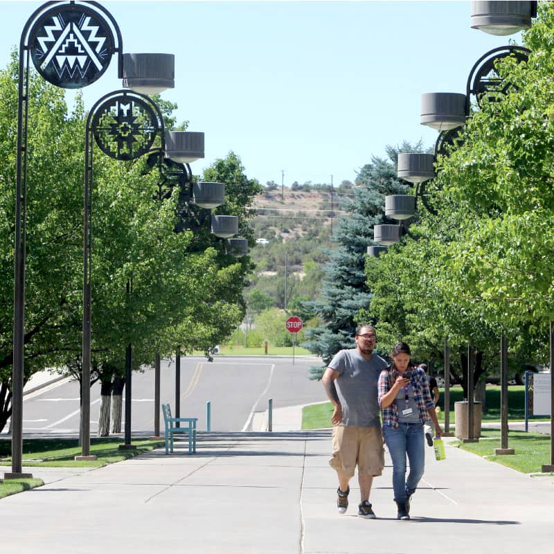 Couple walking up sidewalk to SJC