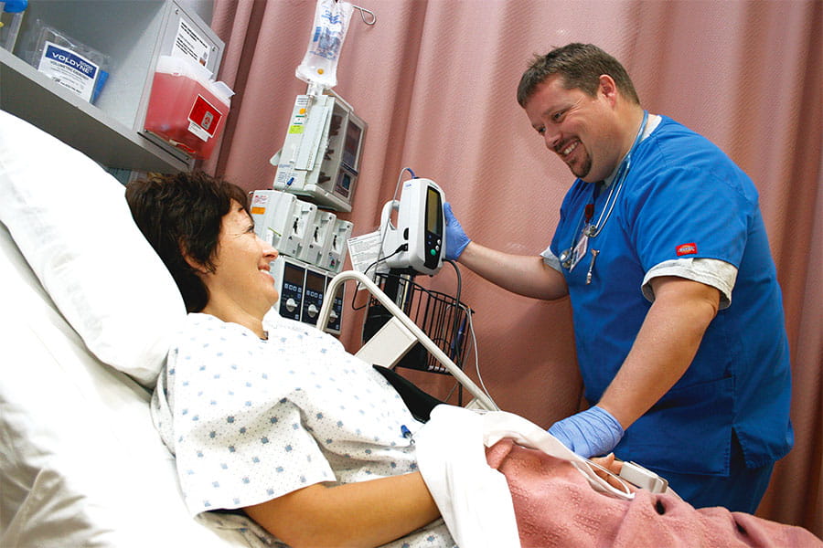 A Medical Assistant taking vitals on a patient