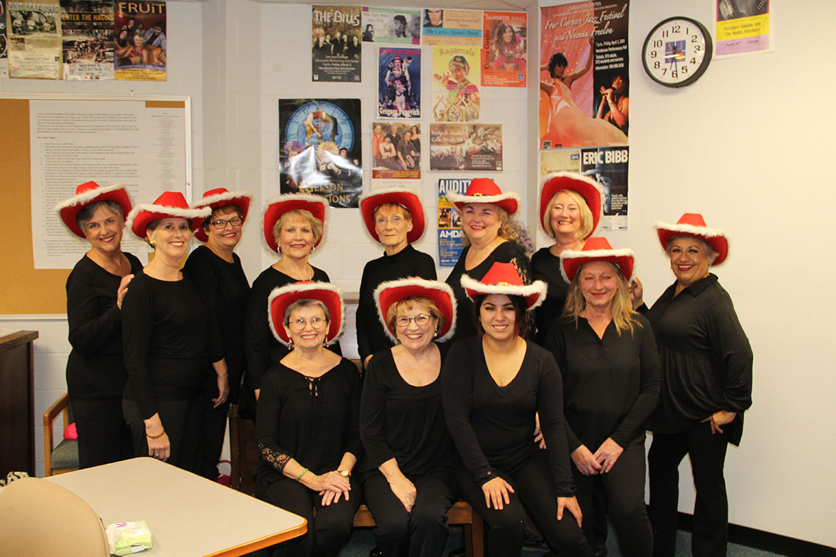 Group of dancers in red cowboy hats