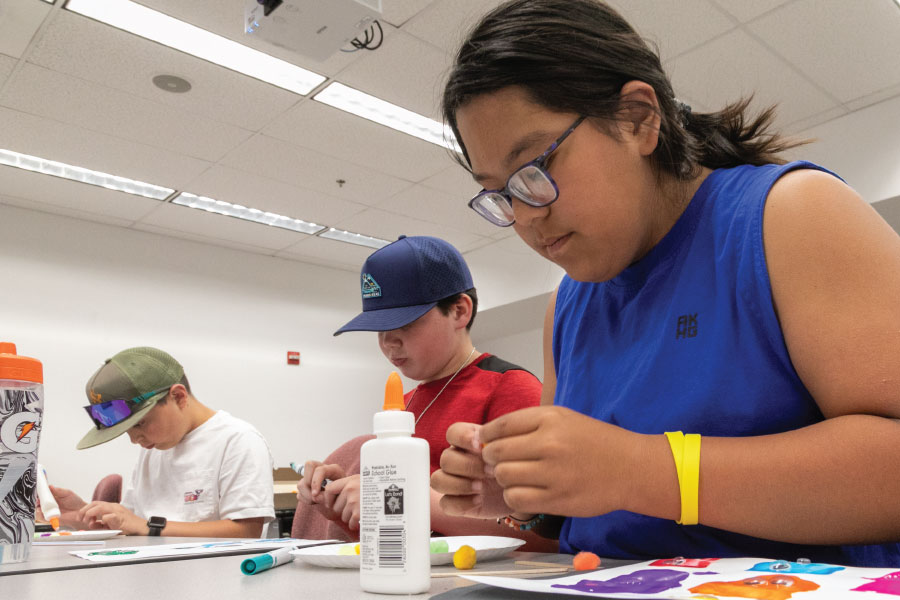 Three Kids Kollege students in a non-credit class