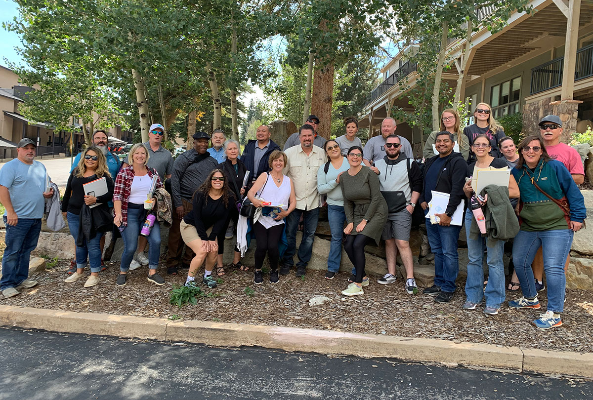 A group of Leadership San Juan Members cheering on a member of Leadership San Juan