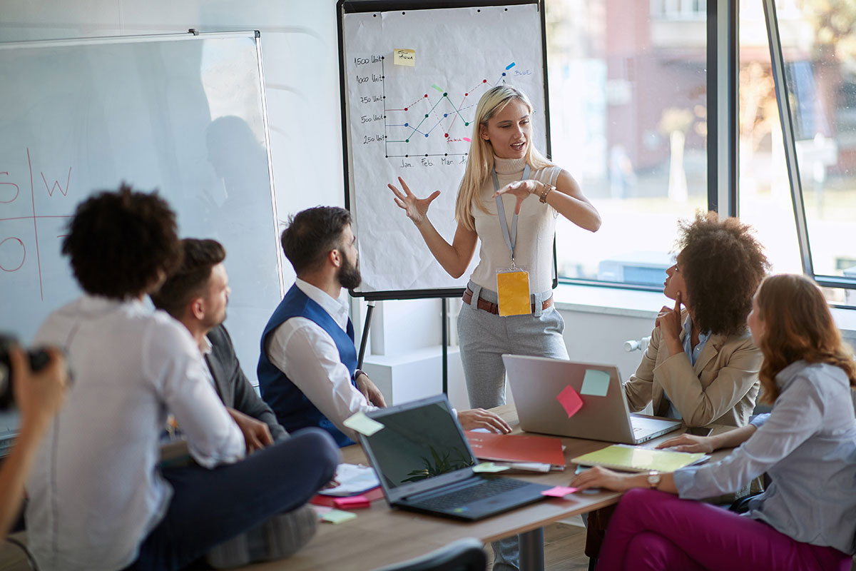 Young woman leads business meeting