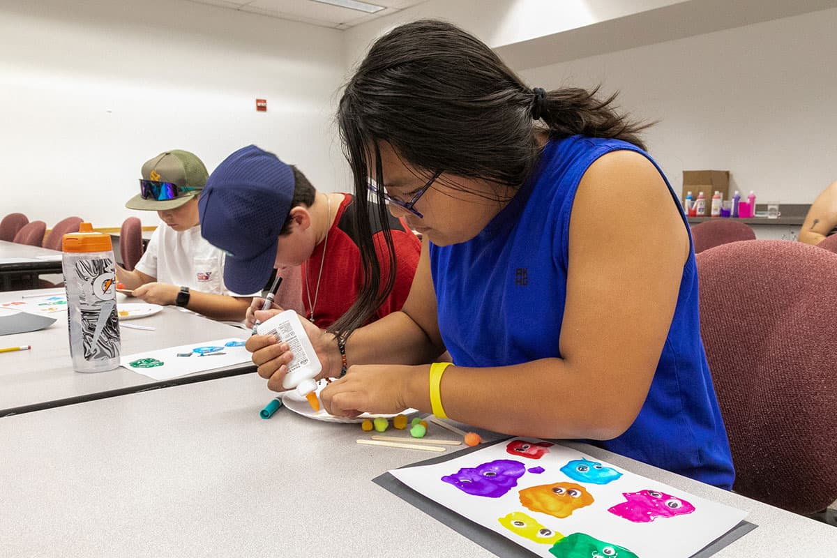 Kids Kollege students taking an arts class