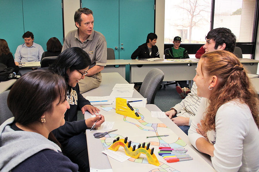 Students having a roundtable meeting