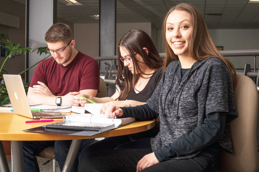 Students gathered at table discussing