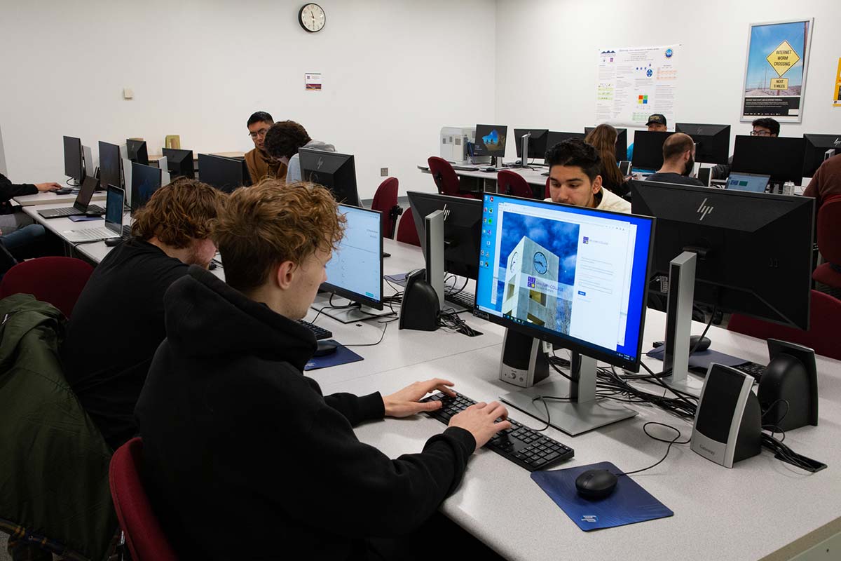 Cybersecurity Center at San Juan College. Students in their classroom on the computers.