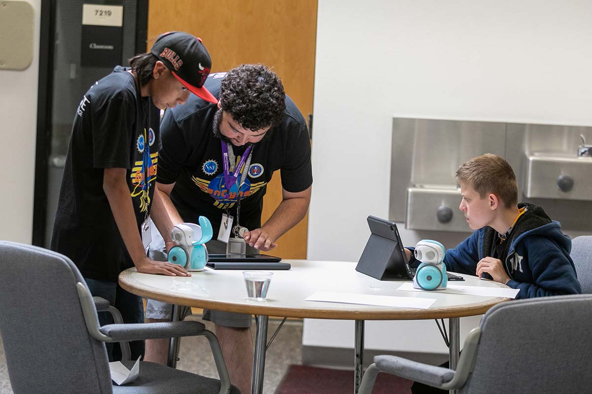 Students working with their robot in GenCyber Camp 2023.