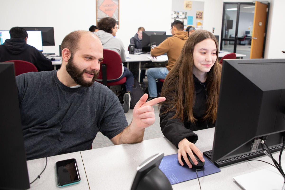 Two SJC students enrolled in the School of Business, Information Technology and Social Sciences