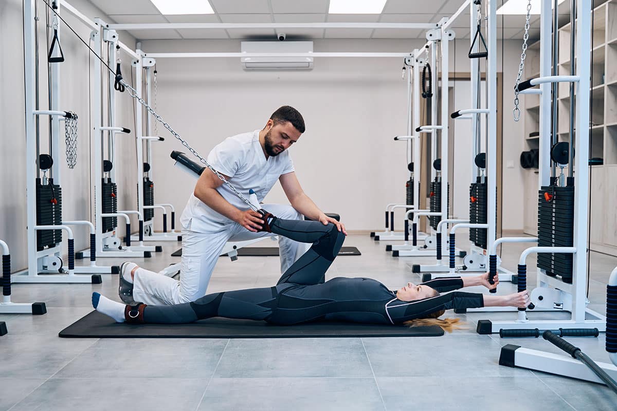 An SJC Physical Therapist Assistant working with a client