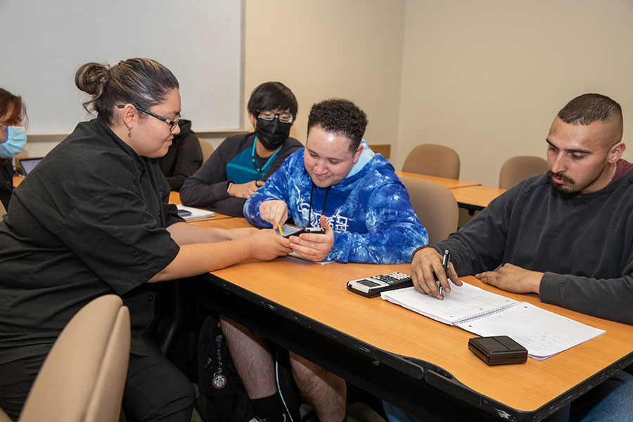 San Juan College students working on math problems together