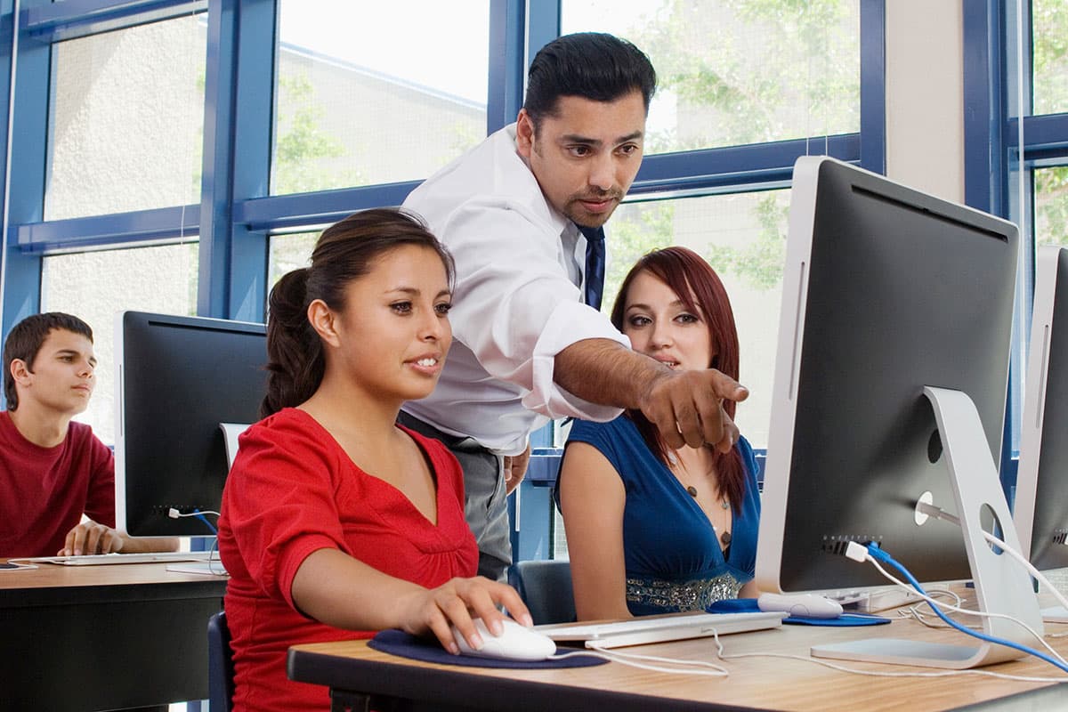 An instructor working with Teacher Education students