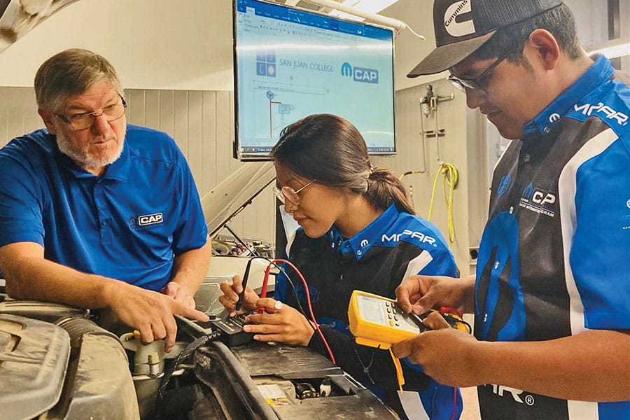 Three students working in their Mopar Chrysler Program at SJC!