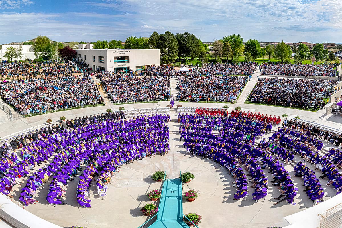 rooftop view of graduation plaza on graduation day showing all the graduates and all the families in attendance