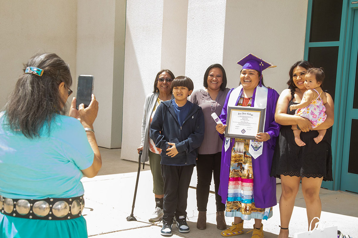 family of graduate celebrate and take photos together