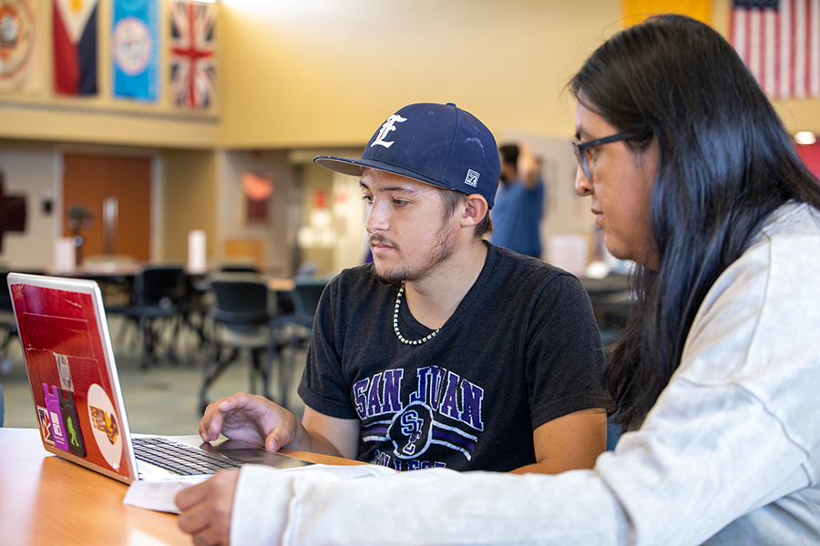 Two students working on a computer