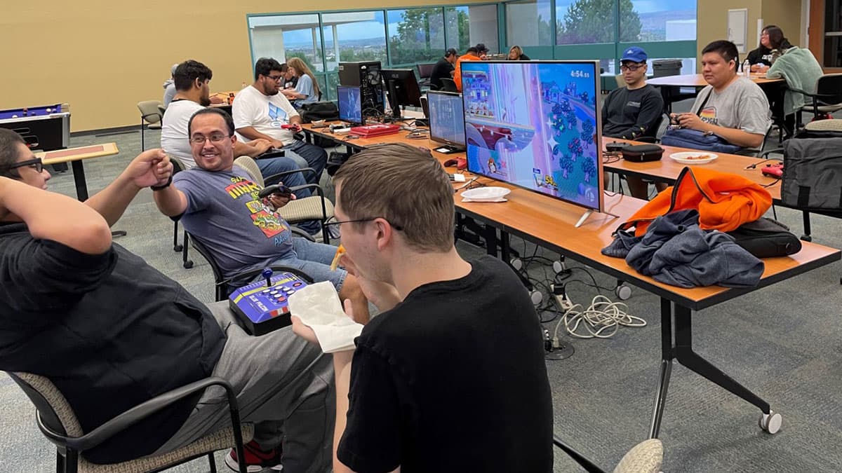 Group of students at tables for Geeks and Gamers