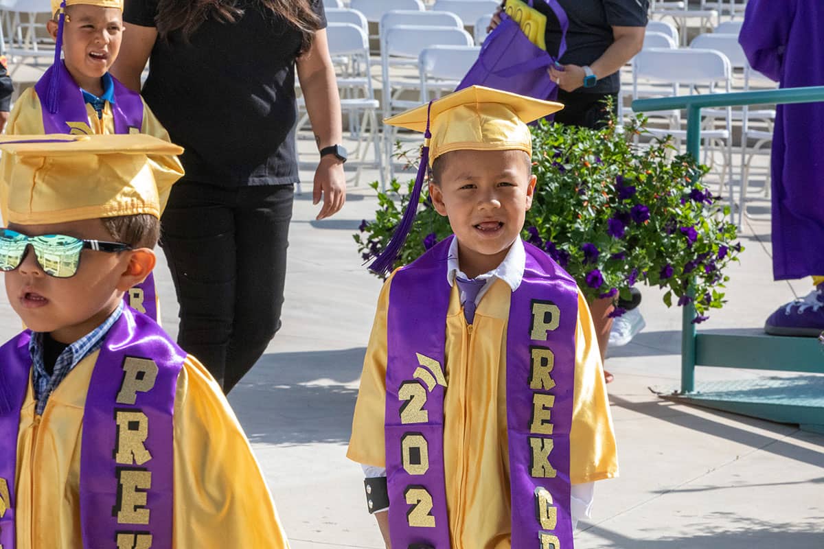 A pre-k San Juan College CFDC student in graduation attire