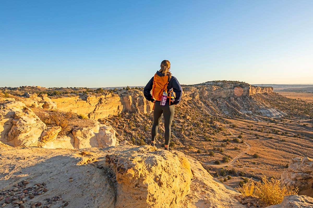 An SJC student taking in the views on top of a mesa