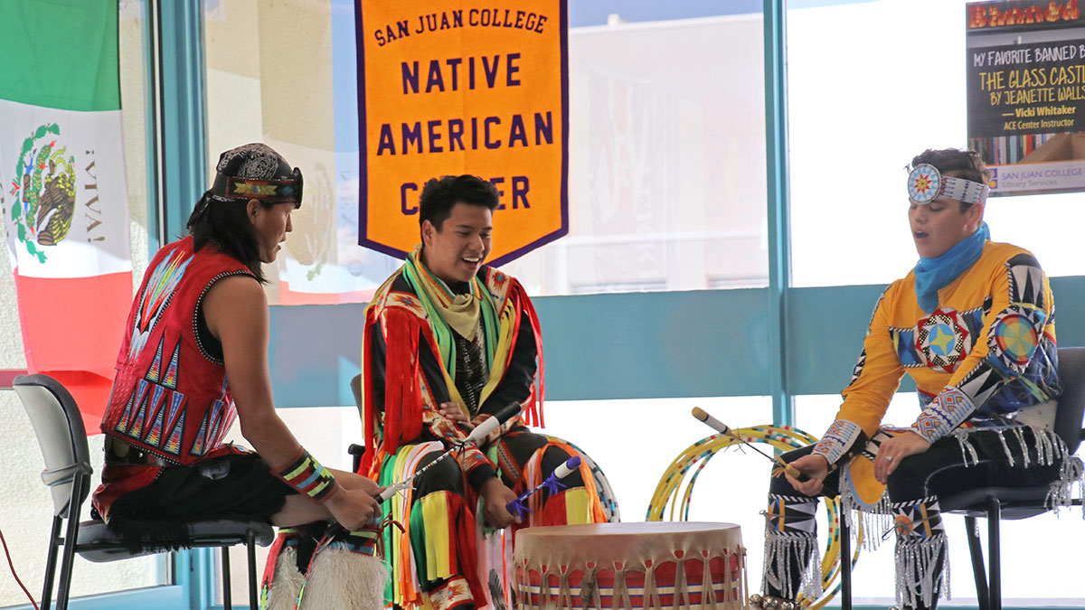 Native American students participating in drum circle