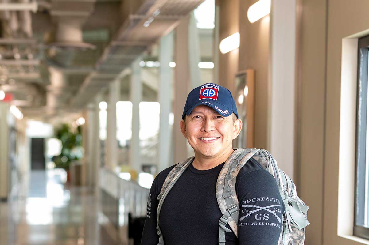 Veteran standing with his backpack at SJC.