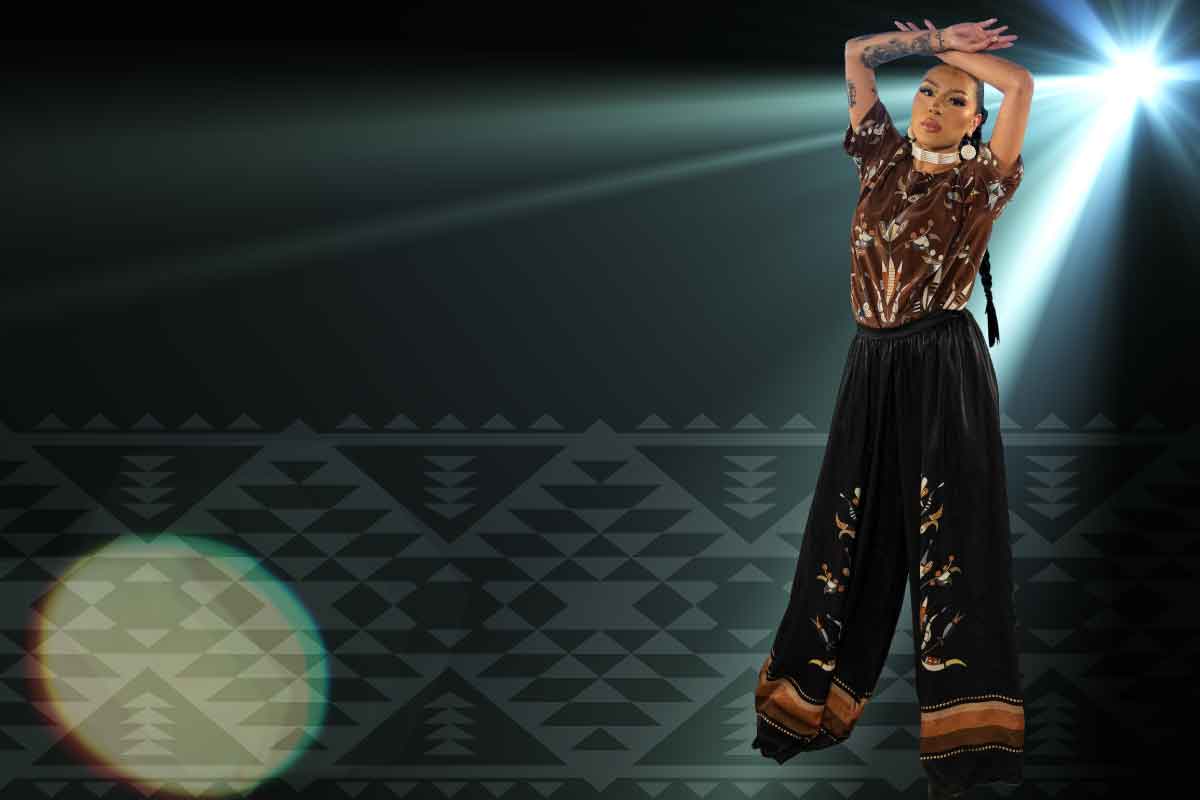 A tribal printed background with a girl to the right in modernized tribal attire
