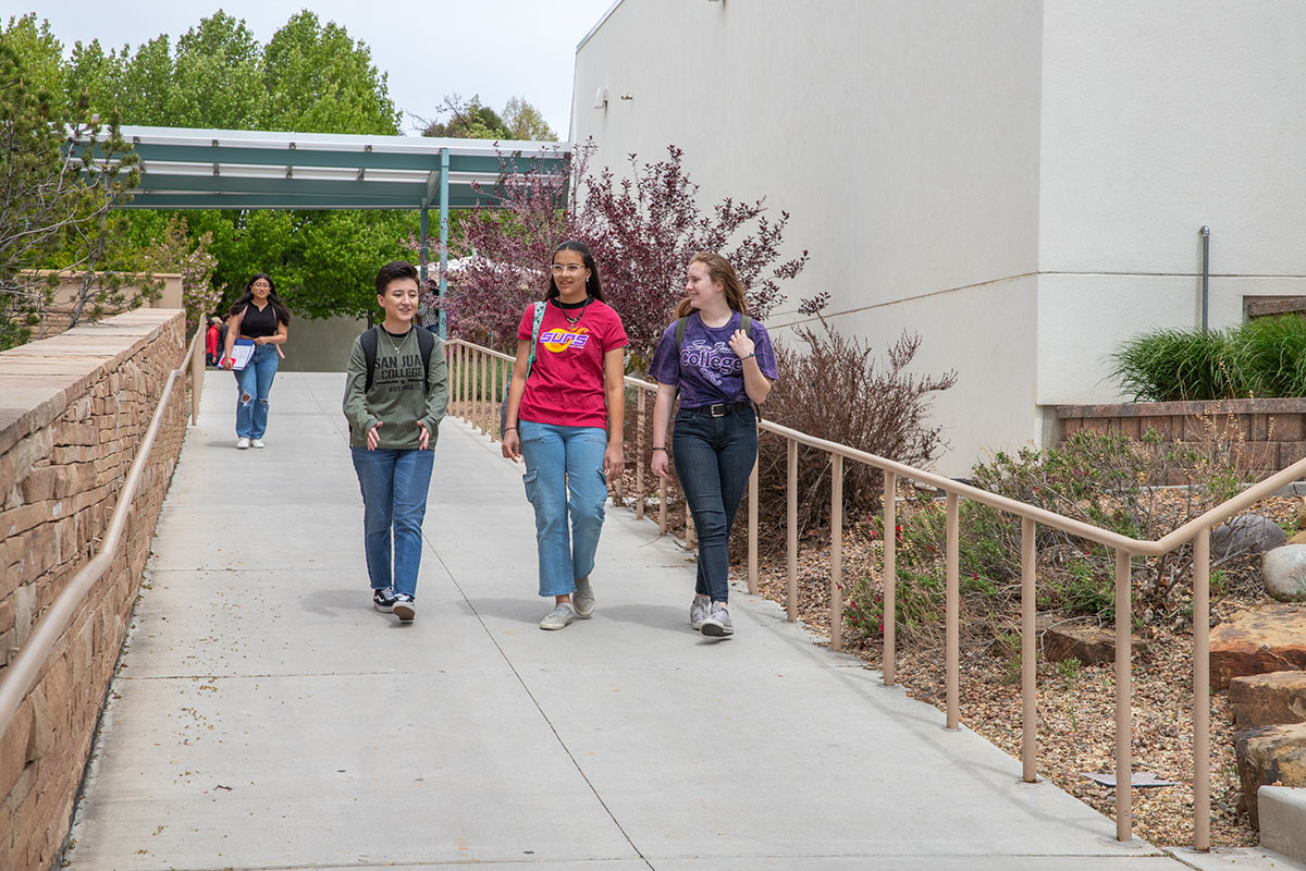 Students Walking by the SJC Clock Tower