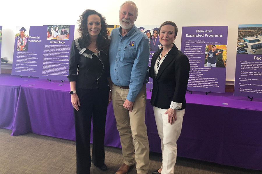 Three Board of Trustees members standing together