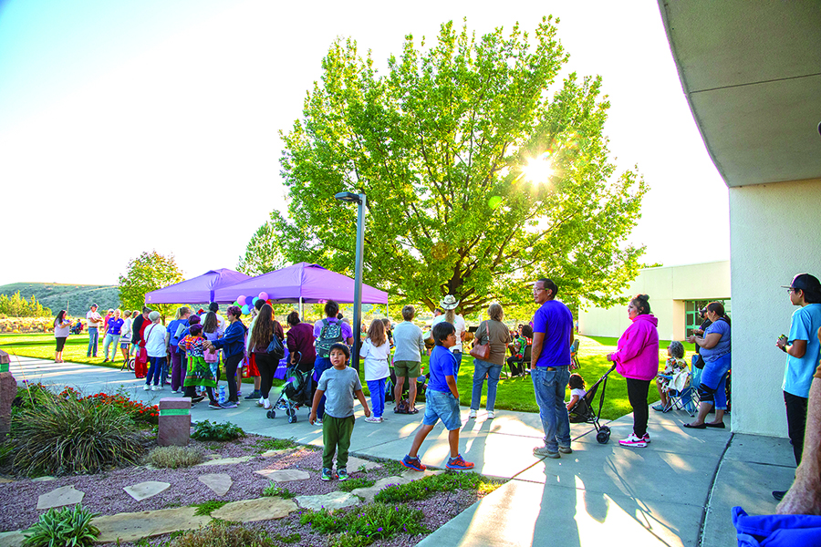 Crowd of people outside on campus