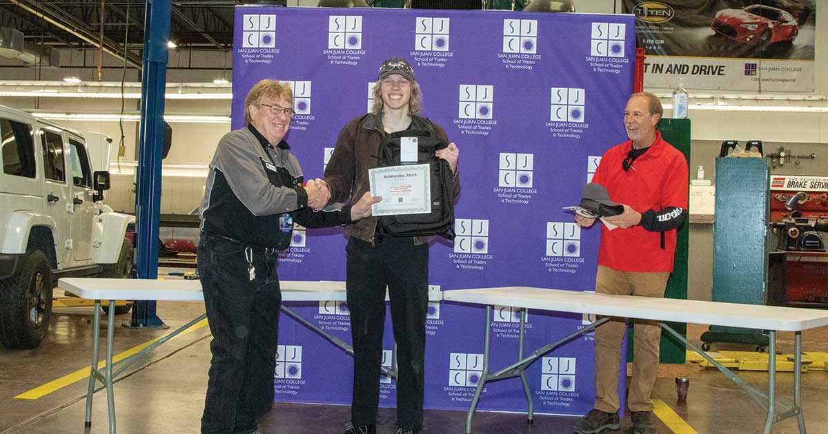 Student receiving an award and shaking hands