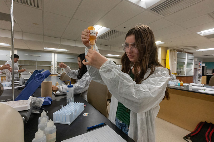 Two students in their Chemistry Lab